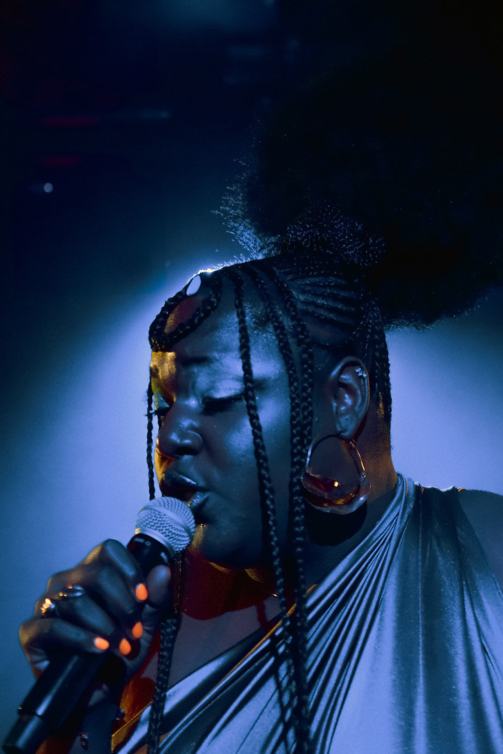 j bambii singing into microphone