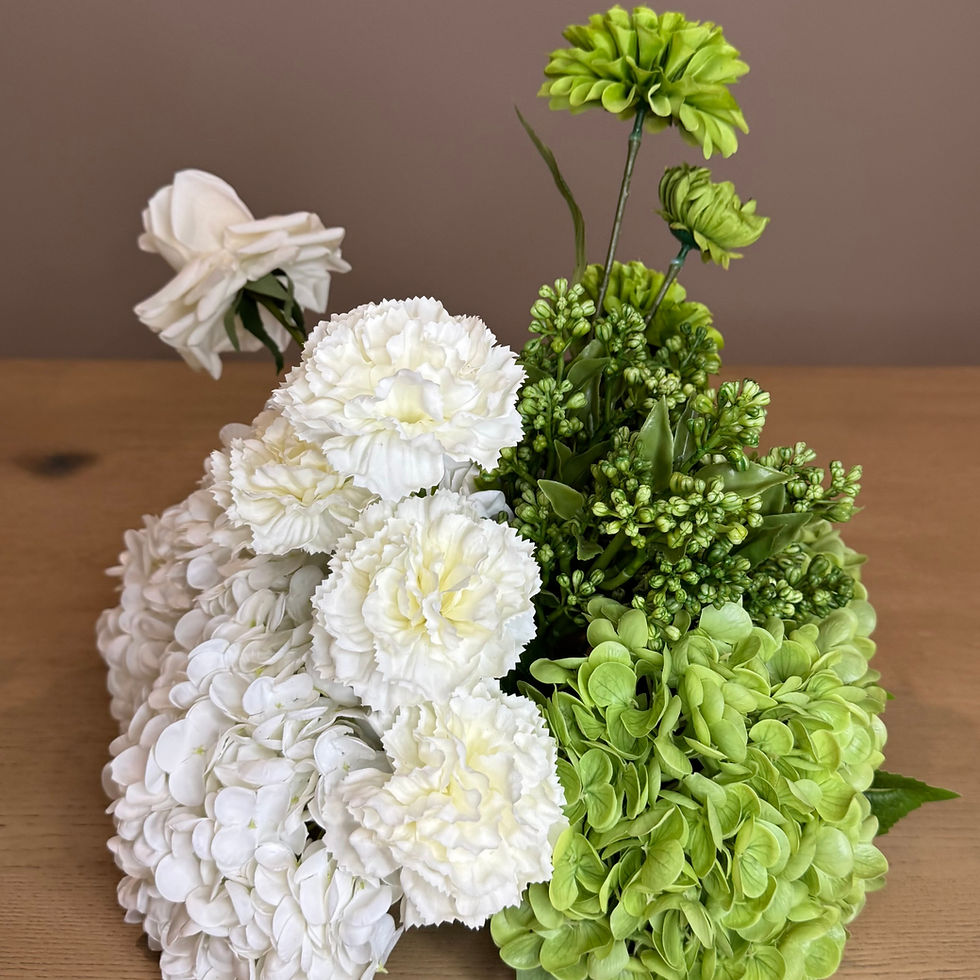 Thumbnail: Small white and green faux floral arrangement for wedding displays.
