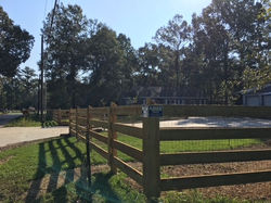 4 foot horse rail fence in front with hog wire, integrated into fence 4