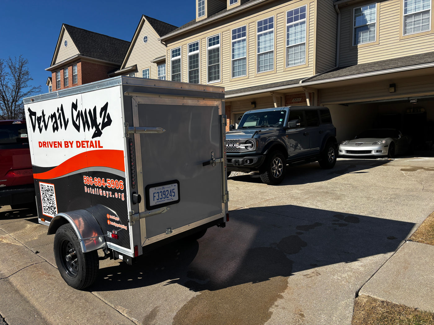 The Detail Guyz mobile trailer set up at a job