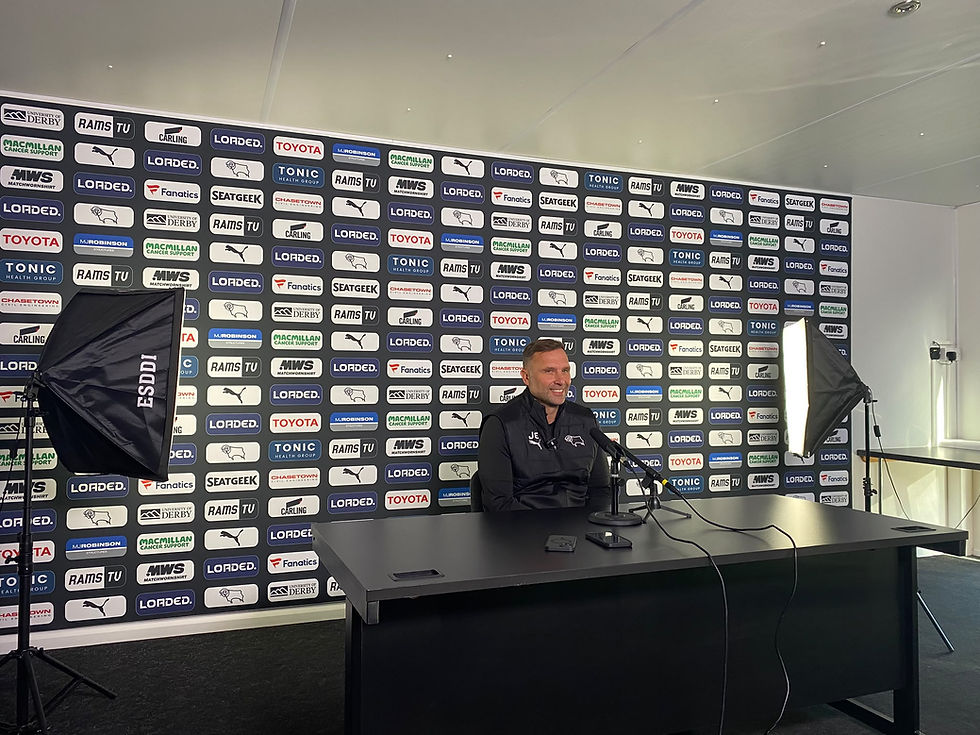 John Eustace sits at a desk in the Moor Farm media room awaiting questions.