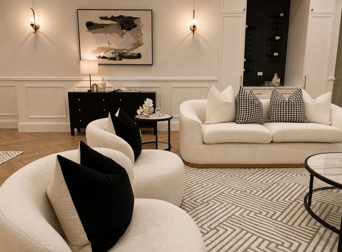 Open-plan luxury living and kitchen styled with premium furnishings, designer lighting, warm timber flooring and timeless contemporary interiors.