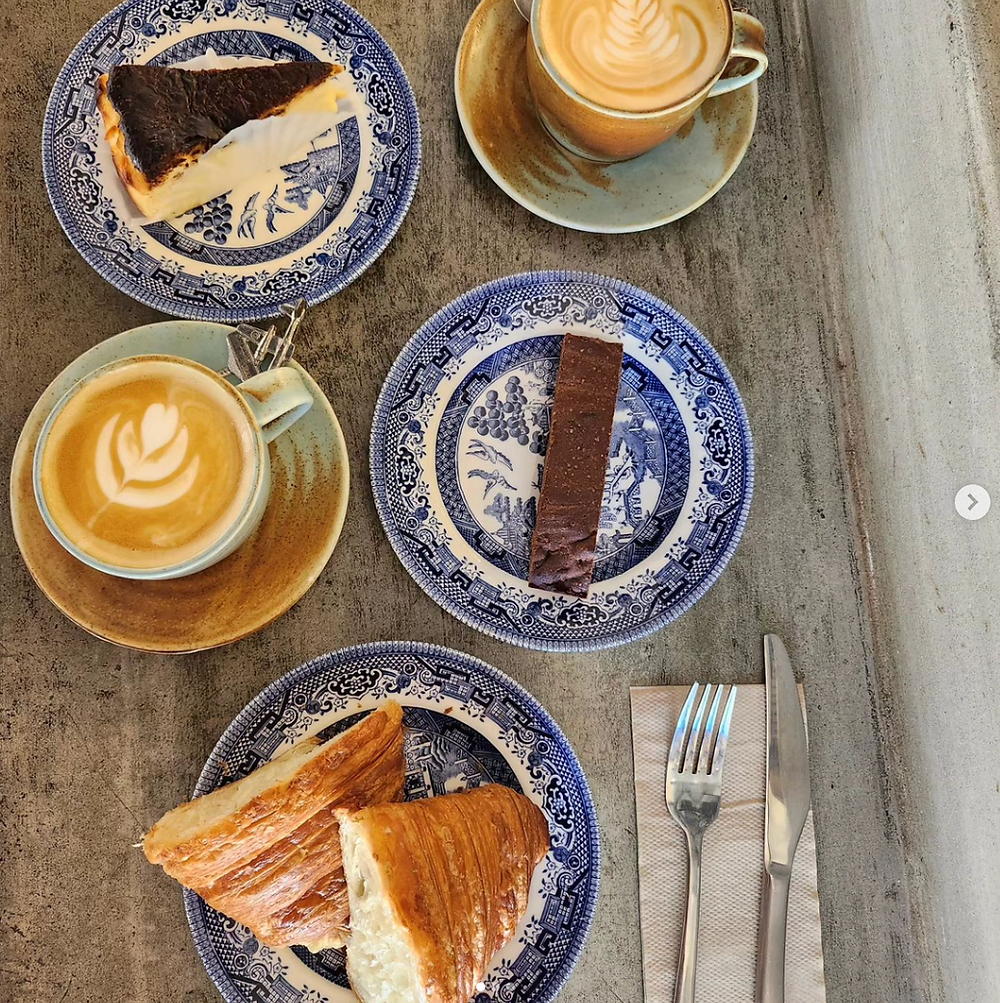 Coffee, cake, and bread on blue plates