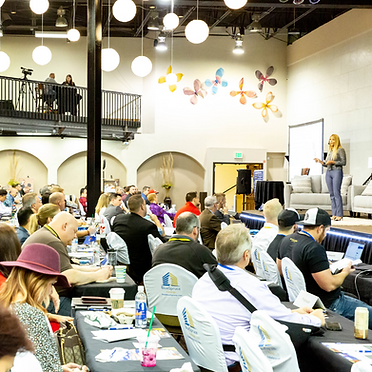 Ellie Perlman public speaking at a real estate investing conference