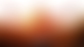woman with outstretched arms at sunrise