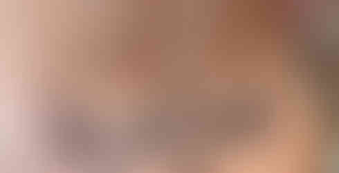 lower back tatoo incorporating fine line and blackwork