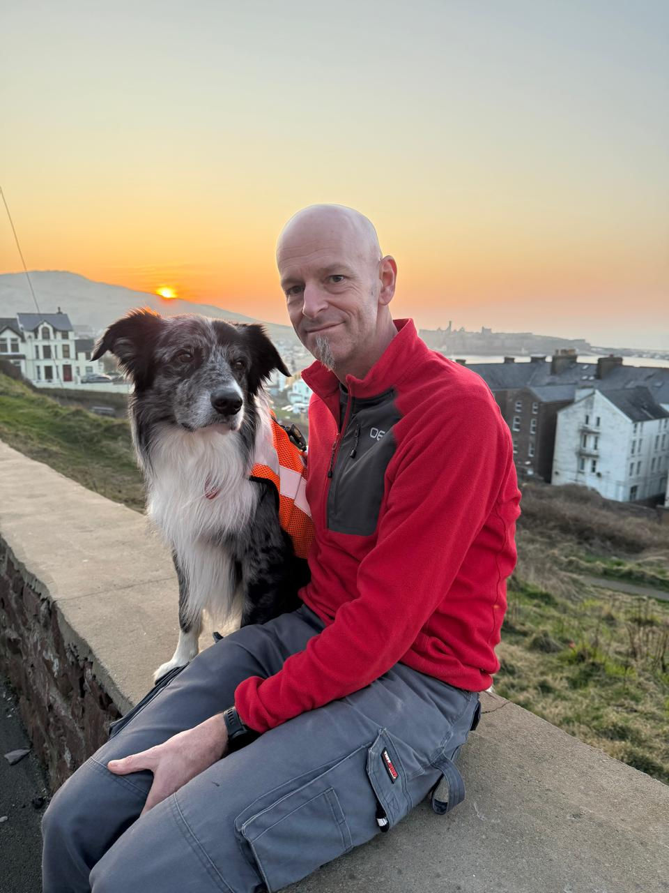Steve showing off his official orange coat and a proud Ben