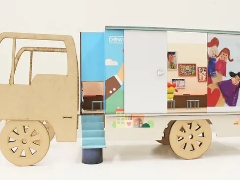 Cardboard moving truck toy with family illustration