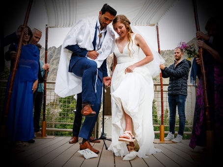 Why Do Couples Smash Glass at Jewish Weddings? The History & Meaning Behind the Tradition