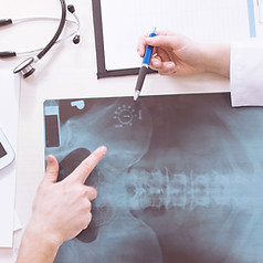 Doctors examining X-ray