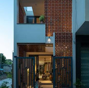 modern facade townhouse Phnom Penh minimalist exterior wood slat design