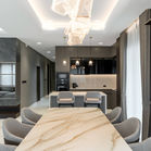 Luxury dining room interior with marble table and decorative chandelier lighting