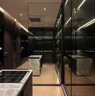 Custom luxury kitchen design with black cabinetry and ambient lighting
