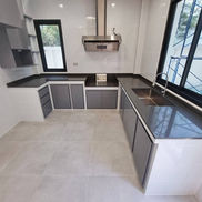 concrete kitchen installation in Phnom Penh with built-in cement counter and storage