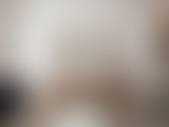 Framed artwork hung at eye level above a console table, demonstrating correct art hanging height in a modern living space