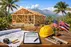 VA construction loan Hawaii Big Island with new home framing, architectural plans, tools, and veteran homebuilding support scene.