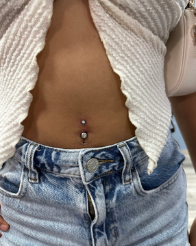 Close-up of belly button with new navel piercing