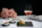 Rose wine with vegetable spring rolls and pink hydrangeas