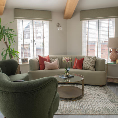 Living room with green sofas