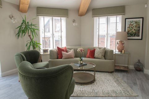 Living room with green sofas
