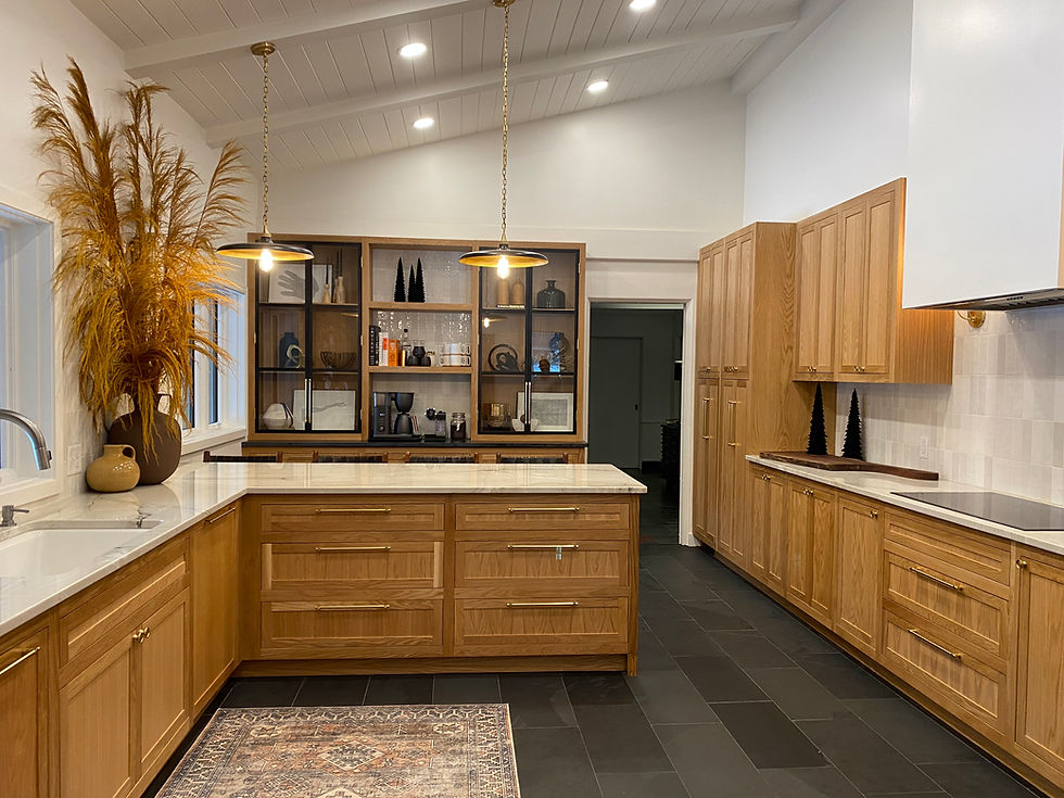 White Oak Cabinets with a coffee bar, metal black doors, rejuvination hardware, quartz countertops, charcuterie boards