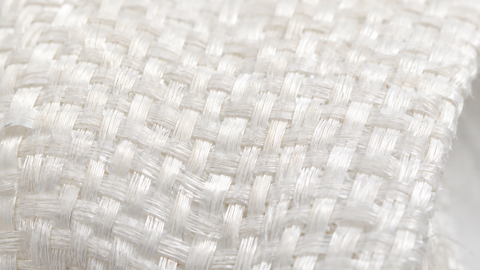 Close-up macro view of tightly woven white PP fabric showing its detailed weave structure.
