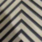 Walnut Herringbone Acoustic Wood Panel close up of the slats