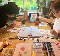 Participants repotting herbs in a gardening workshop at Beezy Tiger Amsterdam