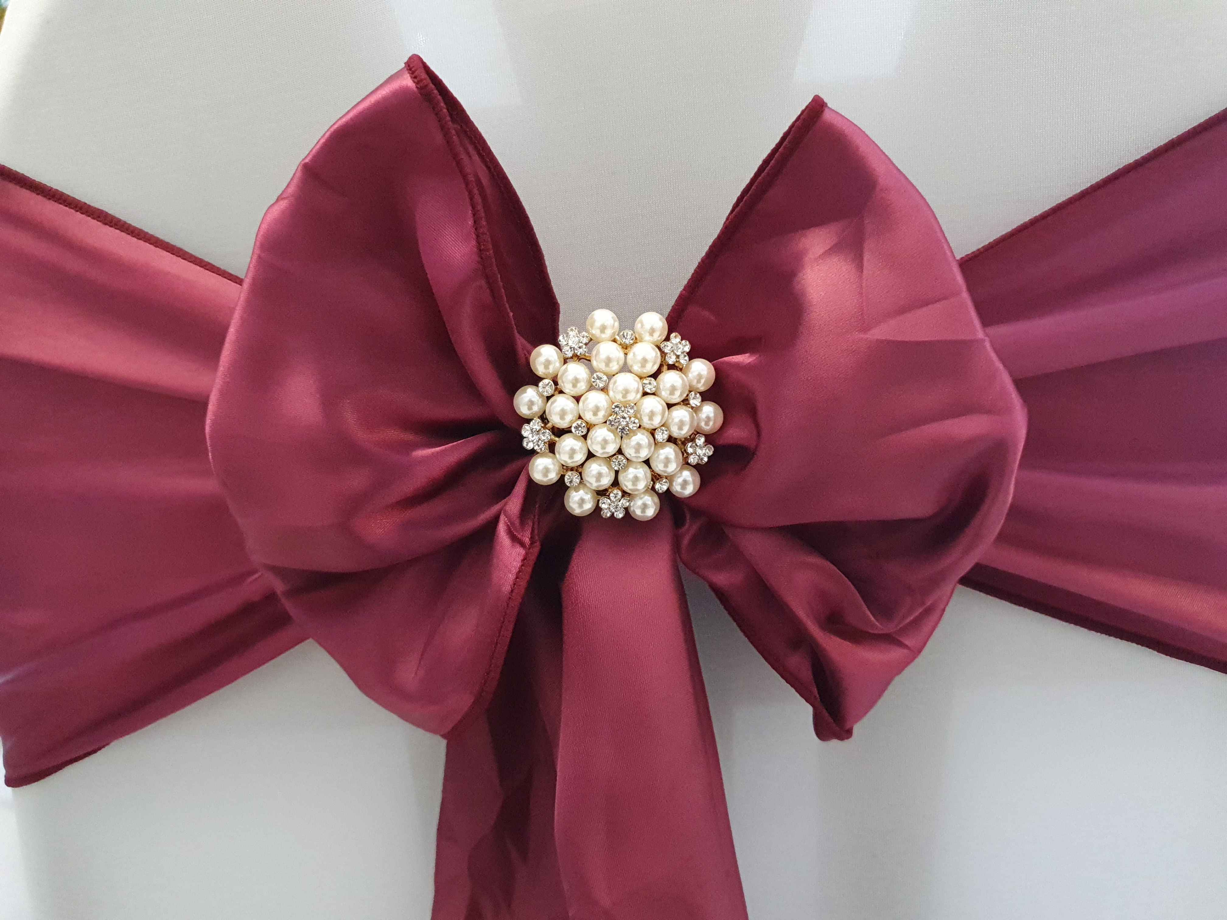 Gold, pearl and diamante chair brooches