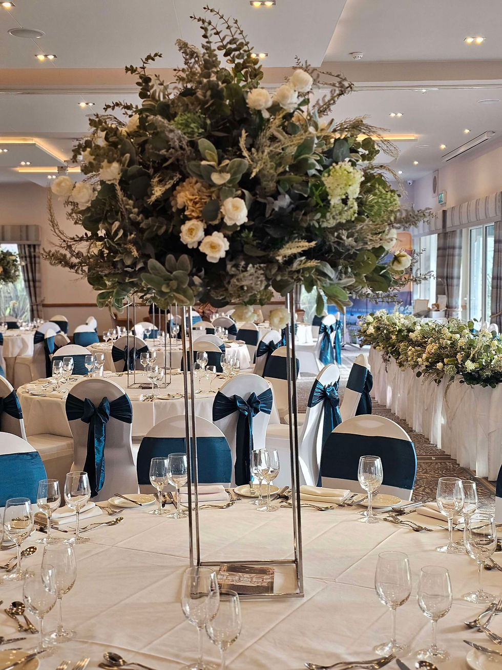 Thumbnail: Charlotte arrangements on columns with candles and garlands 