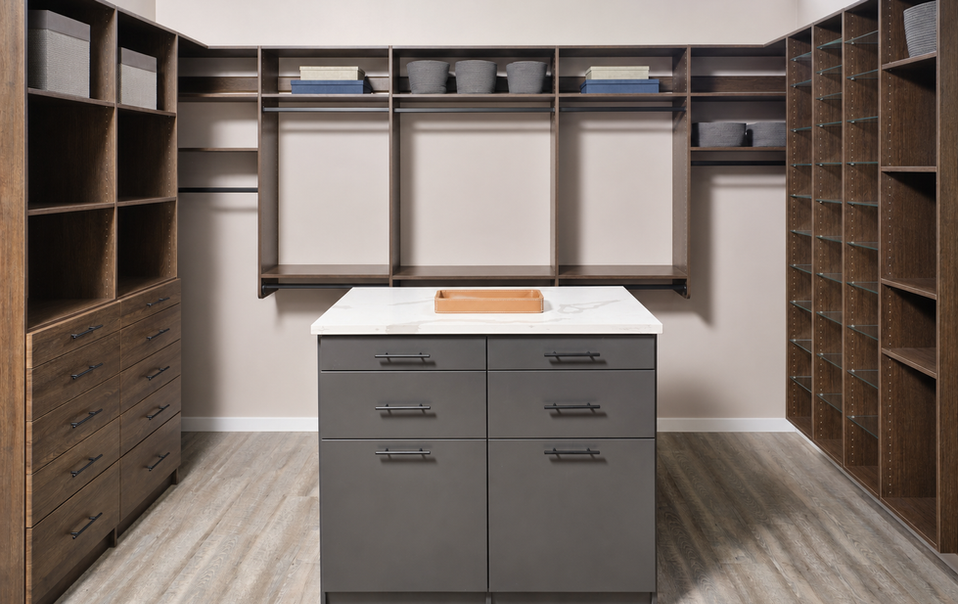 Custom walk-in closet with wood shelving and gray storage island in a Annapolis MD home