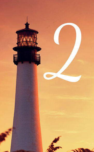 A serene lighthouse at sunset, symbolizing the guidance and professional courtesy outlined in the Bay Renovations Customer Bill of Rights.