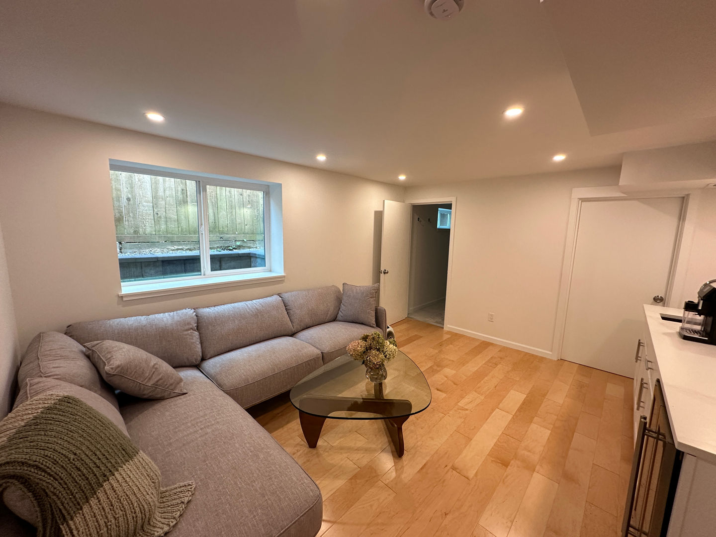Custom egress windows to draw light into the basement