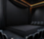 A typical Black Box theatre with a simple stage and chairs surrounding it.