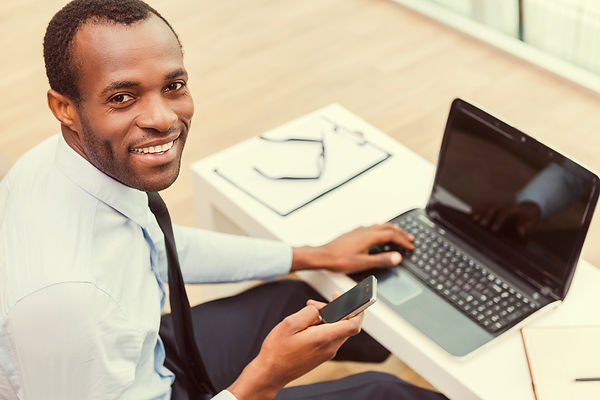 Smiling Man on Laptop_edited.jpg
