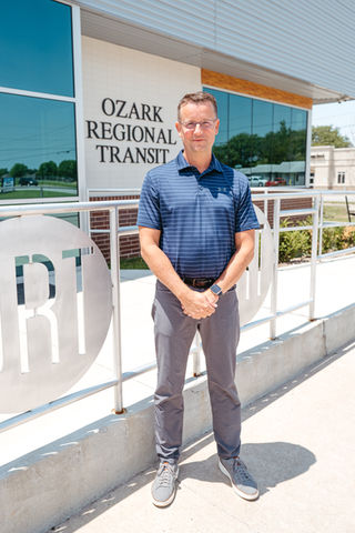 picture of middle age man in front of ozark regional transit building