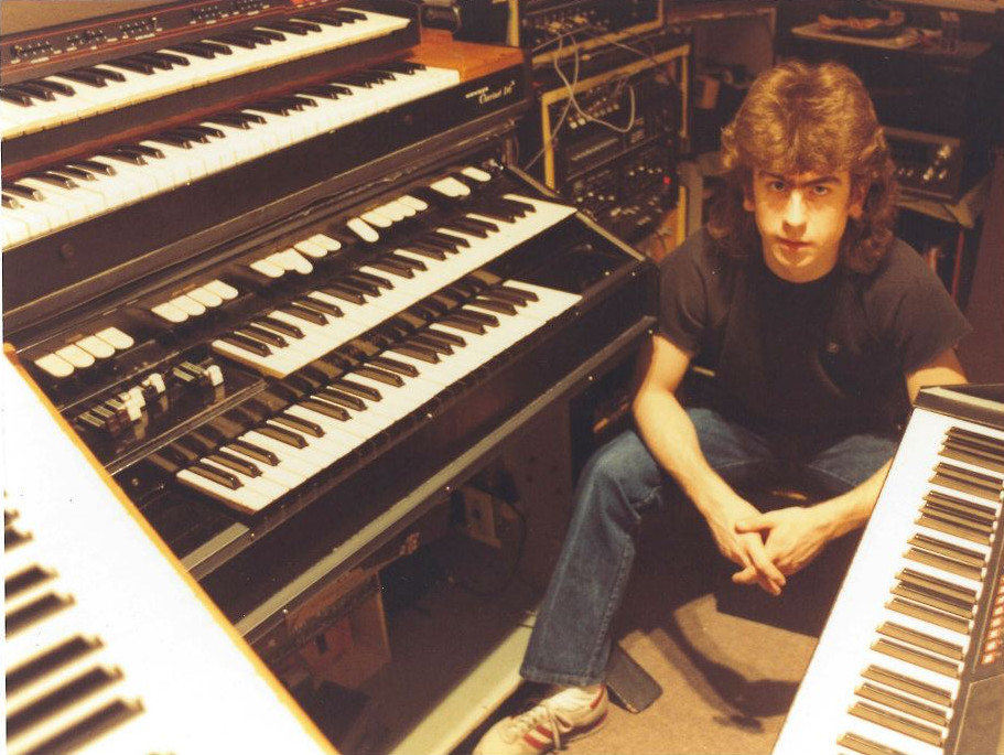 Multi-keyboard setup and Barry Warne featuring an ARP Omni, a Hohner Clavinet, Hammond M-100, Minimoog and ARP 16-voice piano.