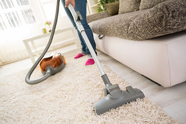 vacuuming a carpeted room