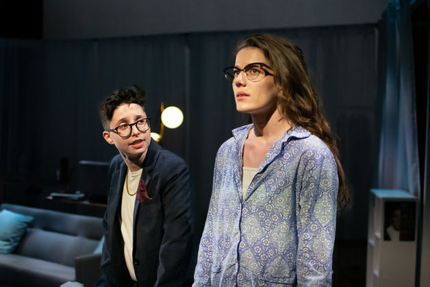 The Gentleman Caller leans over to talk to Stella, who looks out, on the porch.