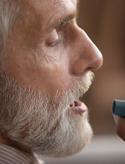close-up-elderly-man-holding-asthma-inhaler.jpg