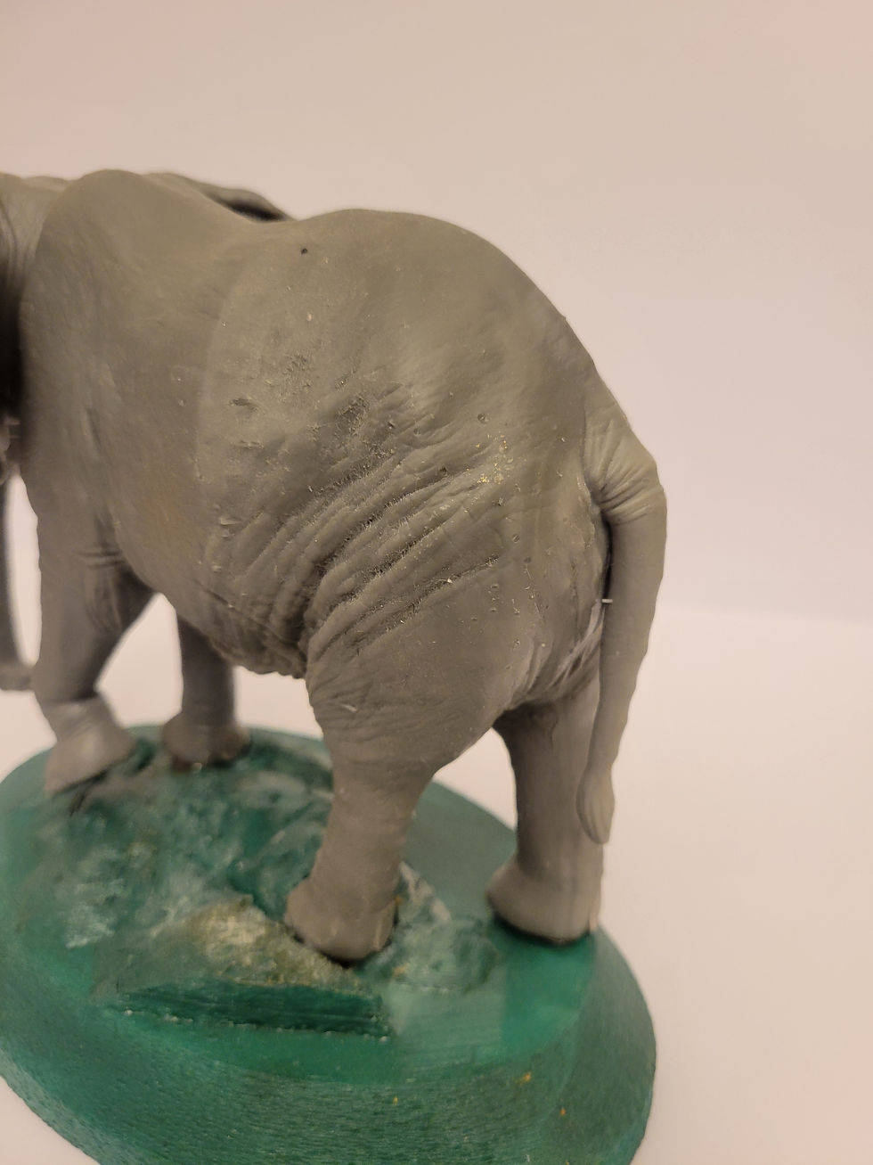 Thumbnail: Elephant statue on green base