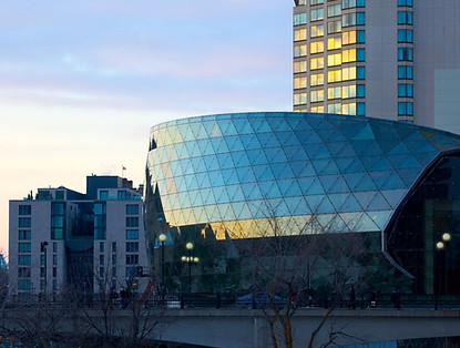 Ottawa Convention Centre (Shaw Centre Ottawa) at dusk, with the Westin hotel in the background.