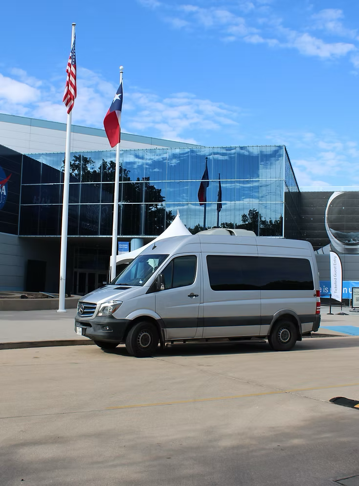 The Astroville Tours shuttle bus in front of the NASA Space Center.