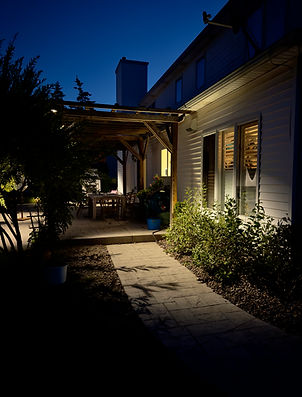 Entrance way to a patio lit with down lighting in Amherst NY