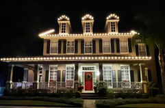 Professional Holiday light installation on a 2 story home in Clarence, NY with custom roofline and holiday lighting c9 bulbs.