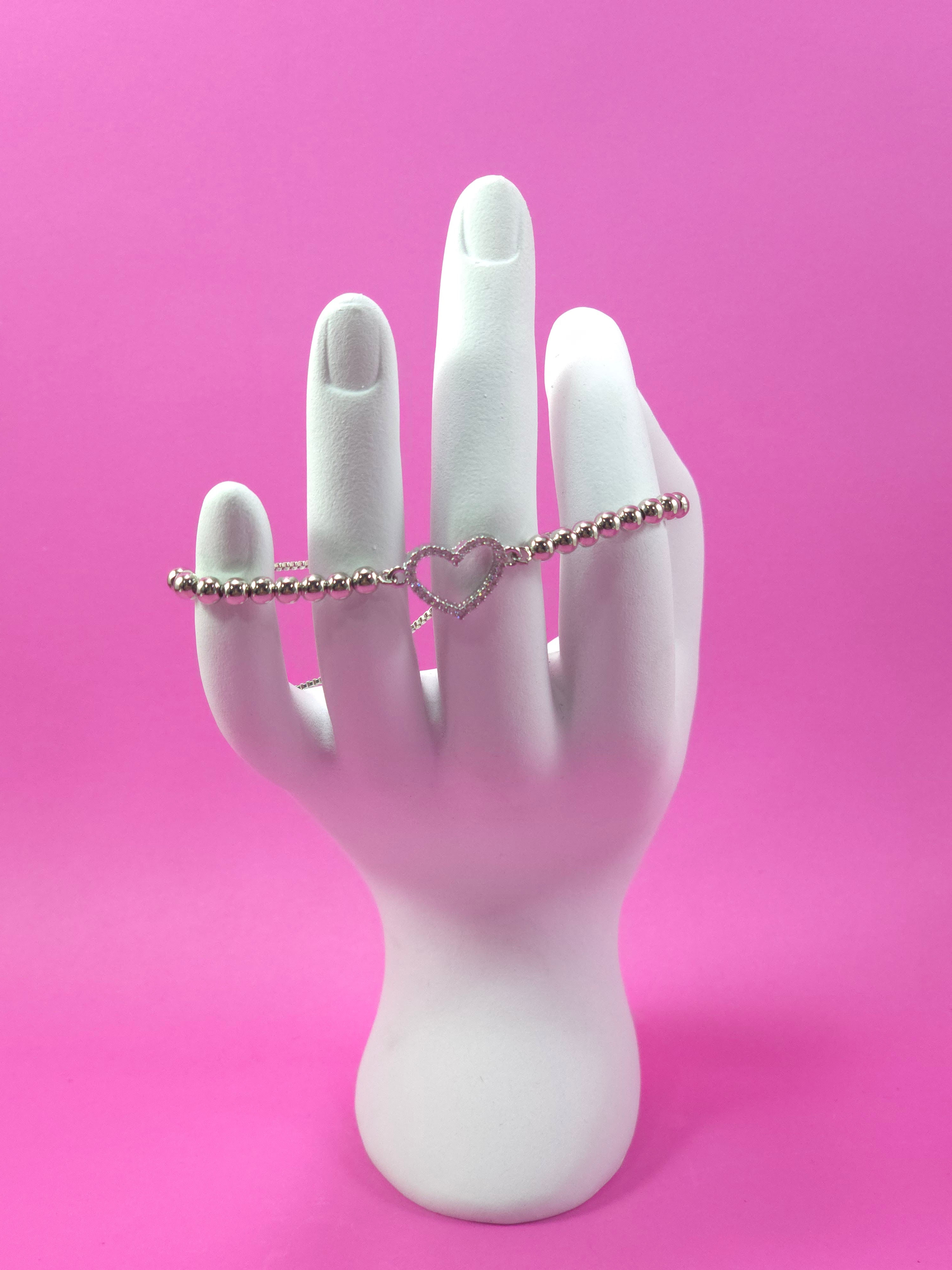 Pulsera cadena plateada con balin con dije de corazon con brillantes