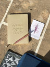 Journal and pencils on a table during a personal reflection session