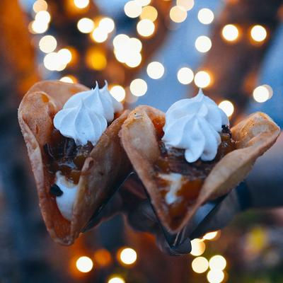 Sweet dessert tacos filled with chocolate, fruit, and whipped cream at Uno Mas - Tex-Mex Cantina in Dallas, TX.