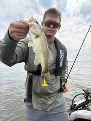 Reel Raw Adventures Dallas TX fishing trip – angler showing catfish catch from Bois d’Arc Lake