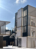 Emphasis Architecture mixed use facade Miami FL shading fins balconies contemporary streetscape